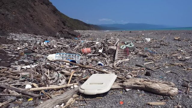 marine garbage debris driftwood Styrofoam Polystyrene foam. Plastic box on deserted shore magnificent coastline stretches behind, Environmental pollution issues.