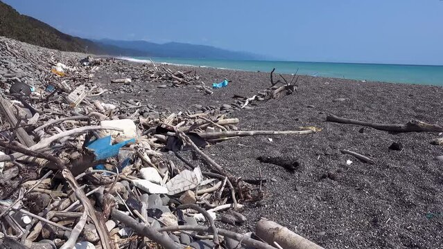 marine garbage debris driftwood Styrofoam Polystyrene foam. Plastic box on deserted shore magnificent coastline stretches behind, Environmental pollution issues.