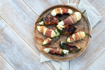 Jalapeno poppers. Spicy peppers stuffed with cream cheese and wrapped in bacon