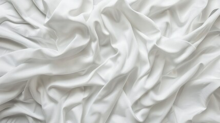 Obraz premium close-up photo of a plain white T-shirt, with soft wrinkles and folds, on a clean white background. 