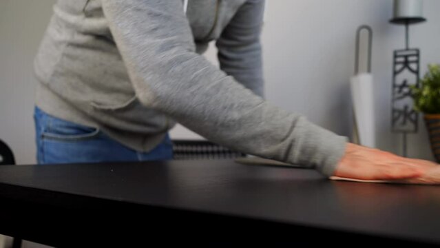 Cropped View Of A Man Cleaning Table After Dinner. Close-up Shot