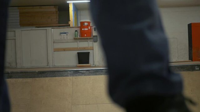 skating an indoor halfpipe skatepark