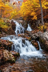 Tranquil Autumn Waterfall Cascading Through a Forested Area at Dusk
