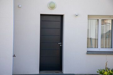 modern white house facade entrance door of street suburban home