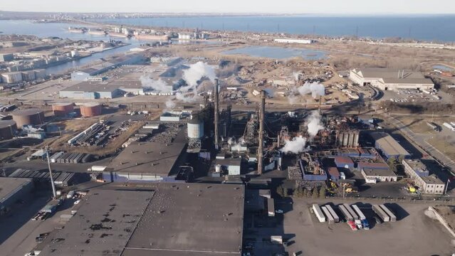 Industrial zone in hamilton, ontario with factories and smokestacks, aerial view