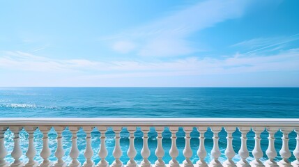 A balcony overlooks the vast expanse of the ocean, offering a peaceful and breathtaking view of the waves rolling in under the clear blue sky 