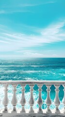 A balcony overlooks the vast expanse of the ocean, offering a peaceful and breathtaking view of the waves rolling in under the clear blue sky 