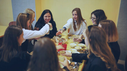 Schoolchildren put down uneaten food in the canteen.