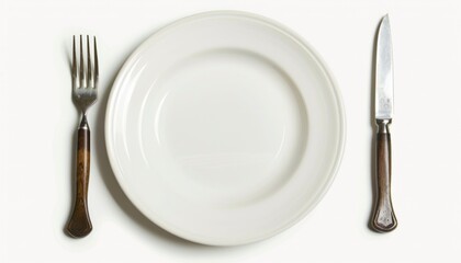 An empy white plate with a fork and a knife next to it, white background