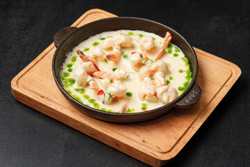 a bowl of food on a cutting board