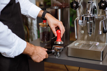 a person using a coffee machine