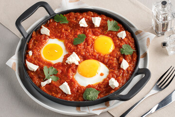 a pan of food with eggs and cheese