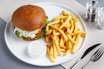 a burger and fries on a plate