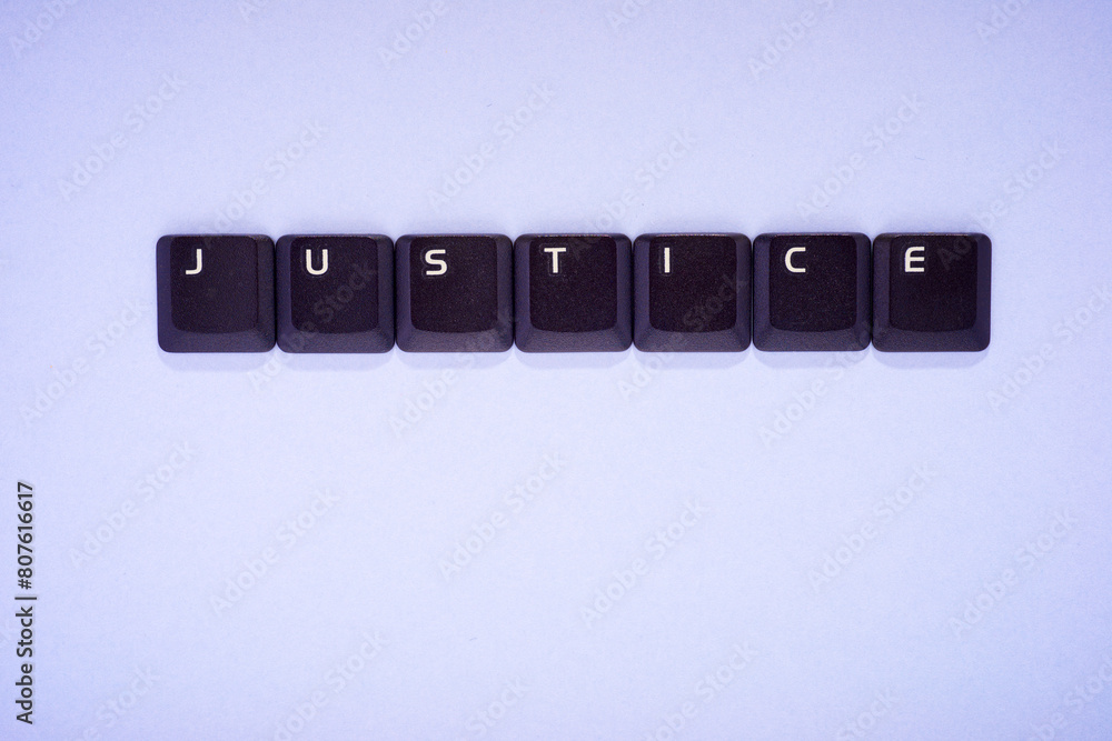 Poster close-up of the keys of an old keyboard creating justice word