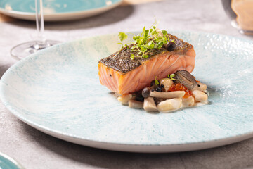 Fine dining luxury food. Salmon with mushroom.