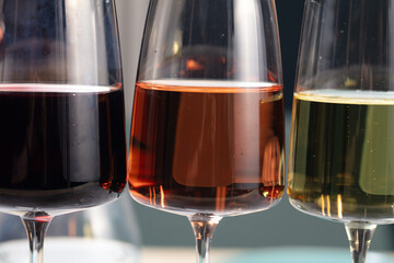 Close up of wine glass with wine. Abstract beverage background. Drink culture.