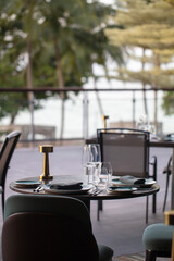 Restaurant table setting. Details of high end dining. close up of luxury plates and cutleries on restaurant table. 