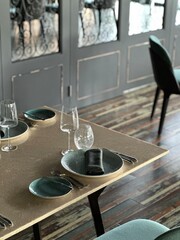 Restaurant table setting. Details of high end dining. close up of luxury plates and cutleries on restaurant table. 