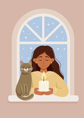 A young woman sitting by the window, holding a candle, with her cat by her side