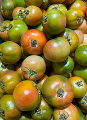 Fresh green persimmons in the market