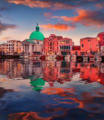 San Simeone Piccolo church and colorful buildings reflected in the calm waters of Mediterranean...