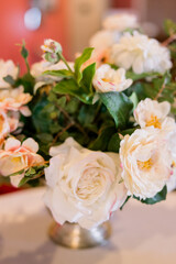 A beautiful bouquet of flowers on a white tablecloth table