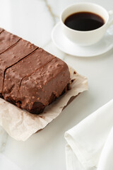 Fresh homemade chocolate sponge cake on wooden board