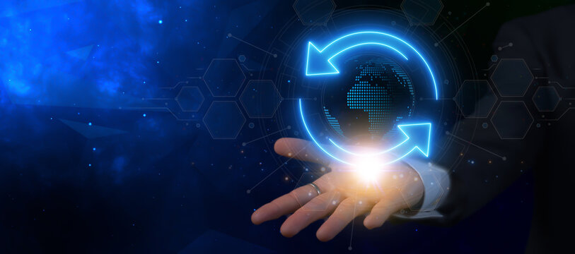 Worldwide business and earth environment protection, social responsibility for nature, global network concept. Businessman showing digital hologram global planet earth with two arrows spinning around.