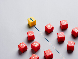 Arrow symbol breaking through the warning signs.