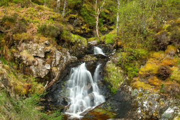 Beautiful waterfall between rocks in the forest