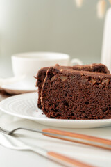 Fresh homemade chocolate sponge cake on wooden board