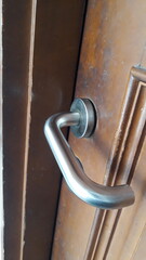 Wooden door with iron cast handle