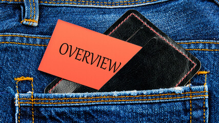 OVERVIEW written on business cards from a purse from a jeans pocket