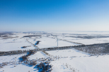 Obraz premium Aerial photography of wind power generation in winter snow