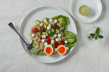 Quinoa salad on white plate from above.