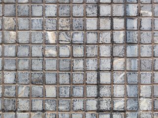 Small square tile on the wall. Abstract background