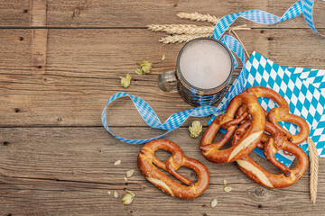 Traditional Oktoberfest set. Pretzels and beer, German festival food concept. Trendy hard light