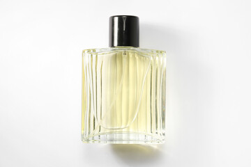 Luxury men`s perfume in bottle on white background, top view