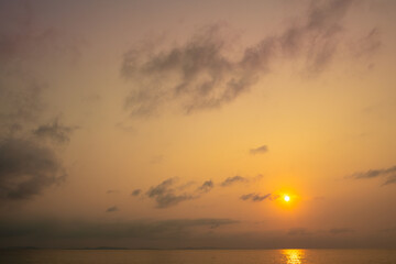 Sea view for summer vacation concept Nature of the summer beach and sea with soft sunlight. hitting the sand The sea sparkles against the sunset sky.	