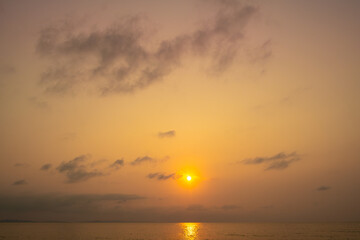 Sea view for summer vacation concept Nature of the summer beach and sea with soft sunlight. hitting the sand The sea sparkles against the sunset sky.	