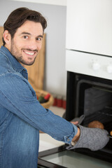 side view portrait of handsome man cooking