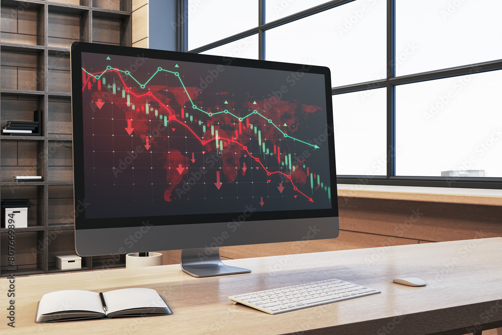 Poster close up of wooden office desk with book and downward red forex chart on computer monitor. blurry ba