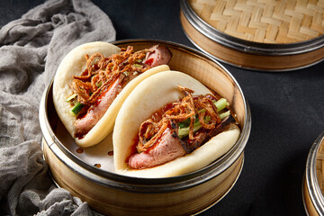 Gourmet Bao buns with roast beef and crispy fried onions; a modern twist on a classic Asian dish