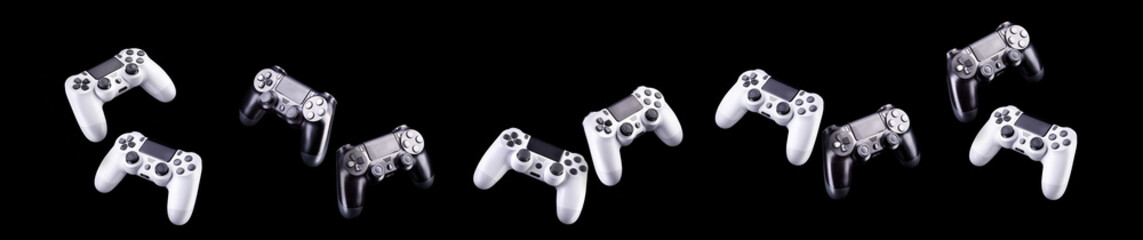 Set of video game joysticks gamepad isolated on a black background © Vasyl Onyskiv