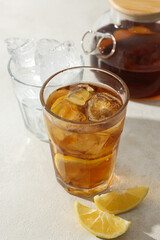 A glass of delicious cold tea on a white background