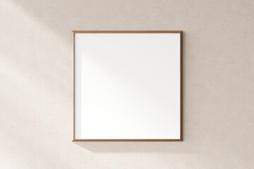 A minimalist blank picture frame hung on a textured wall, ideal for inserting your personalized...