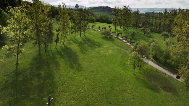 Museum of the Szekler gates (Muzeul Portilor Secuiesti in Romanian language) in Odorheiu Secuiesc city from Harghita county in Romania. Aerial view of this landmark museum during a sunny day. 4k video