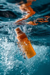 Vivid orange bottle cascading through water, creating sparkling ripples and bubbles
