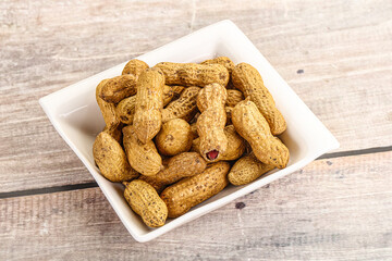 Raw ripe unpeeled peanut heap