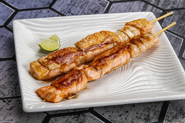Grilled salmon skewer with sauce
